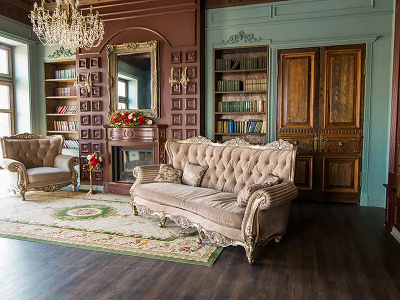 An opulent room filled with antique Victorian furnishings.