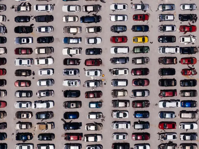 Aerial view of a large parking lot full of cars.