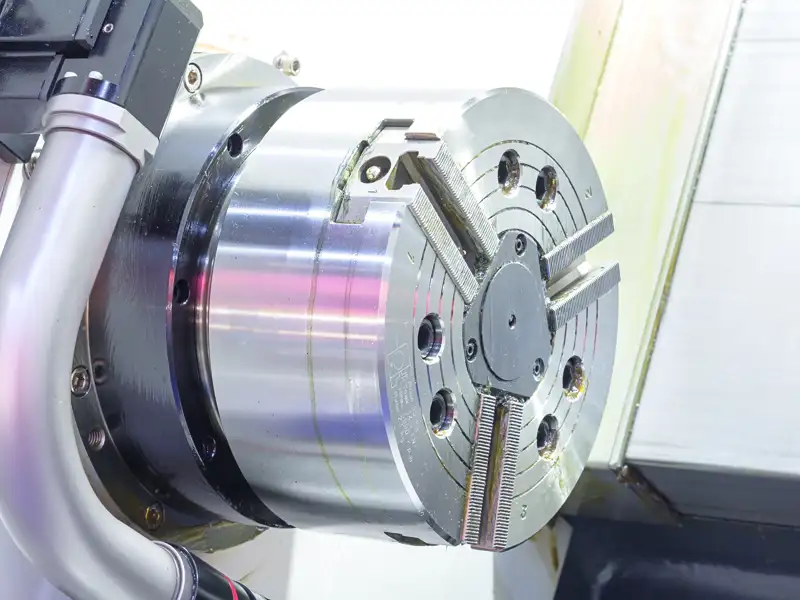 A three-jaw chuck on a metal lathe.