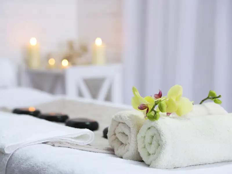 Towels and other items on a massage table.