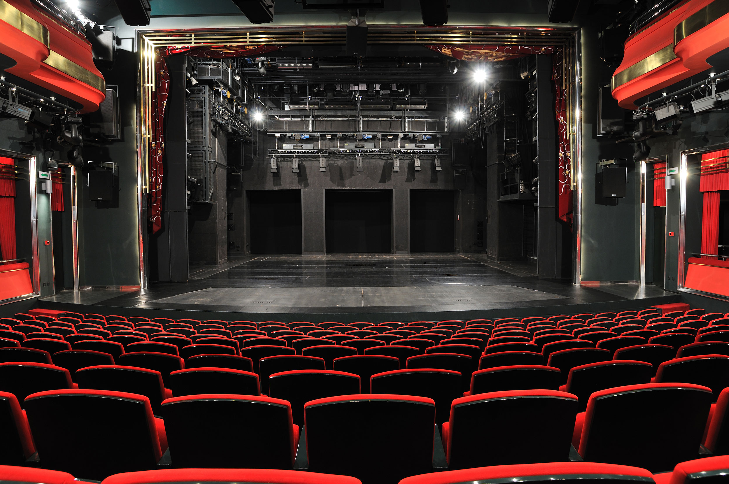 An beautiful red-themed, but empty theatre awaits a grand new production.
