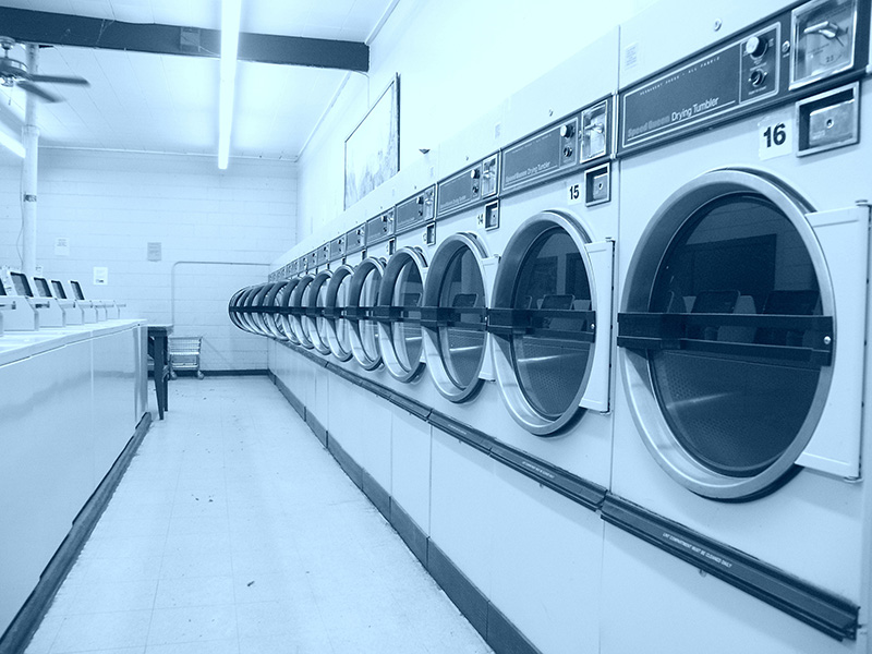 A row of dryers in a launderette.