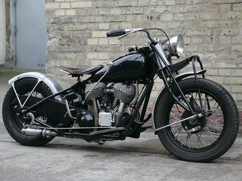 A black vintage v-twin motorcycle.