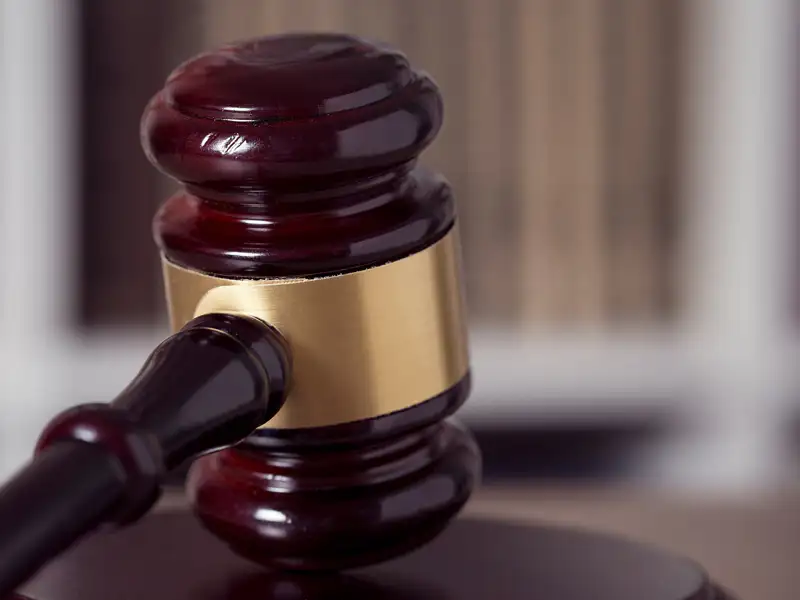 A gavel hitting the bench.