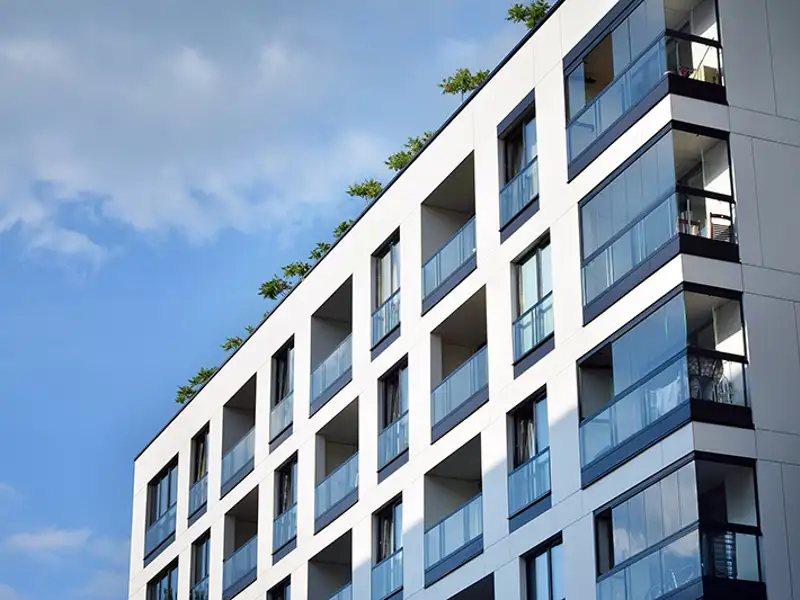 A view of balconies in a residential high-rise apartment building.