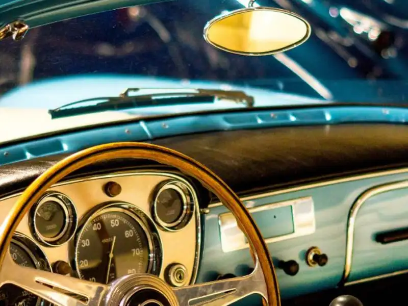 The dashboard of a classic car.